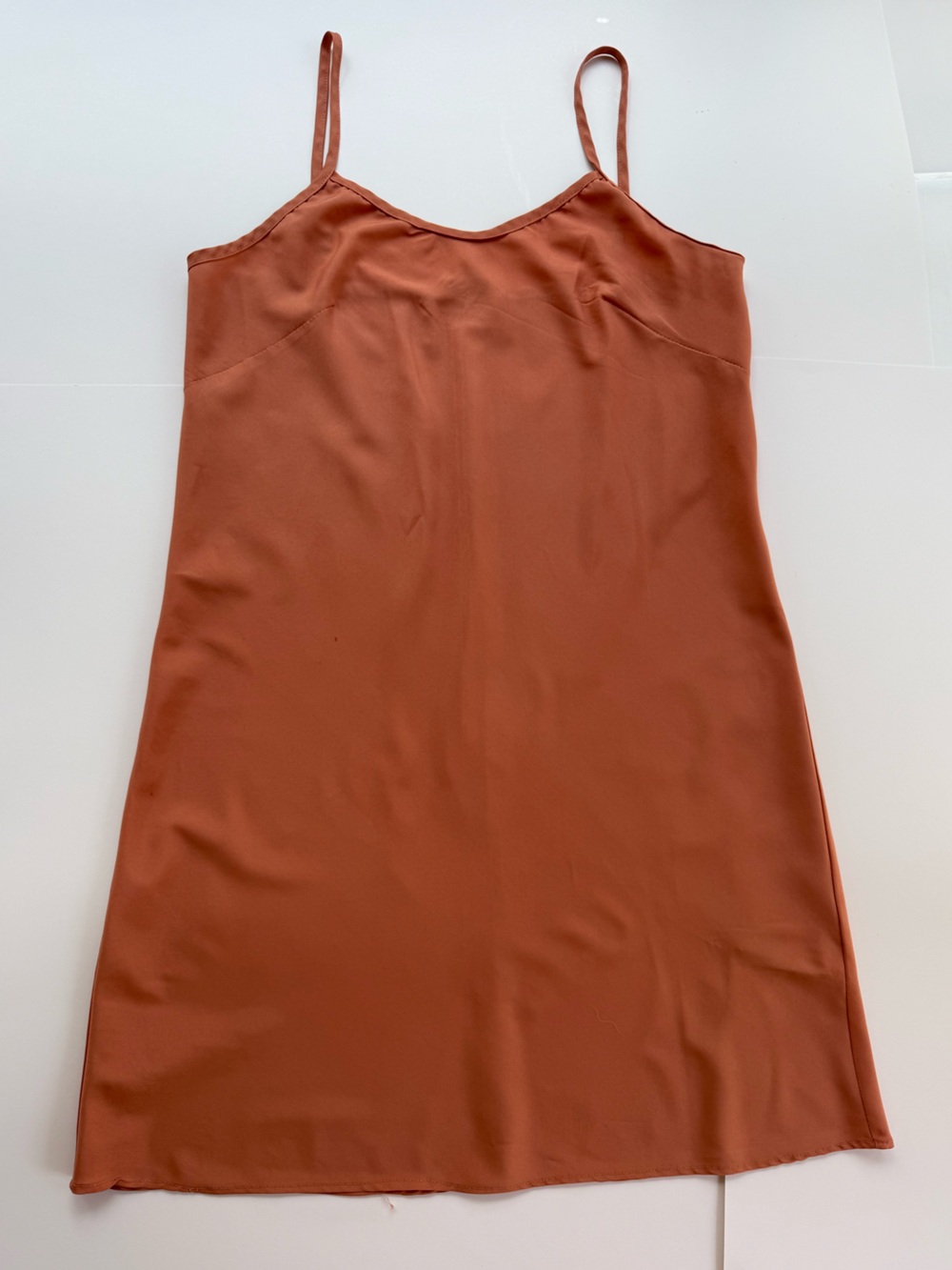 rust-orange slip dress featuring spaghetti straps and a v-neckline sz 4